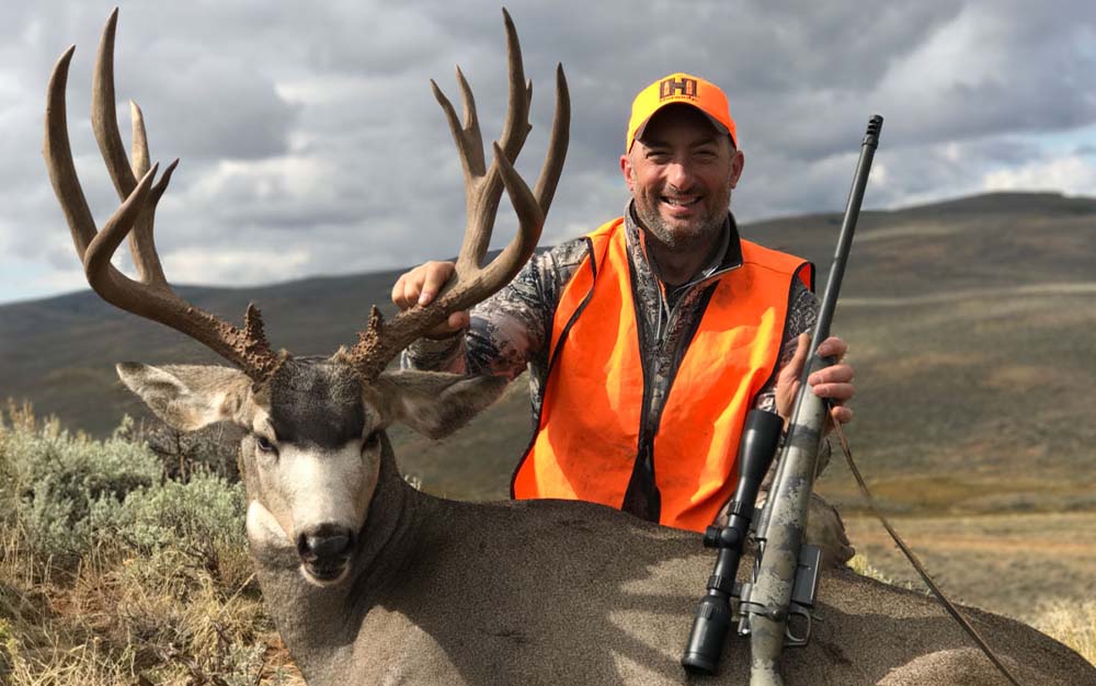 John Snow with a Mule Deer