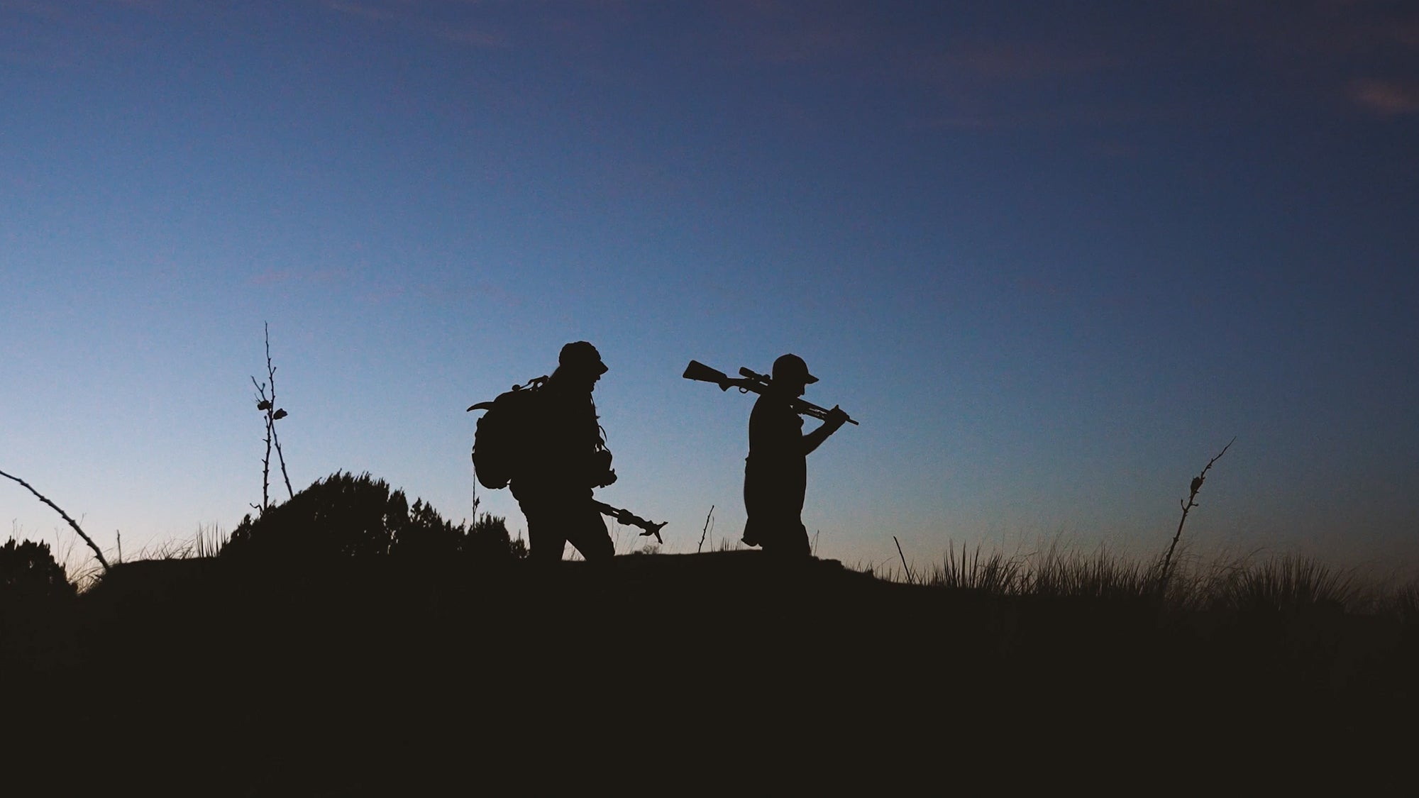 photo of hunters packing out aoudad ram