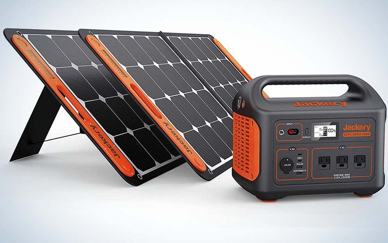Black and orange solar panels and a generator