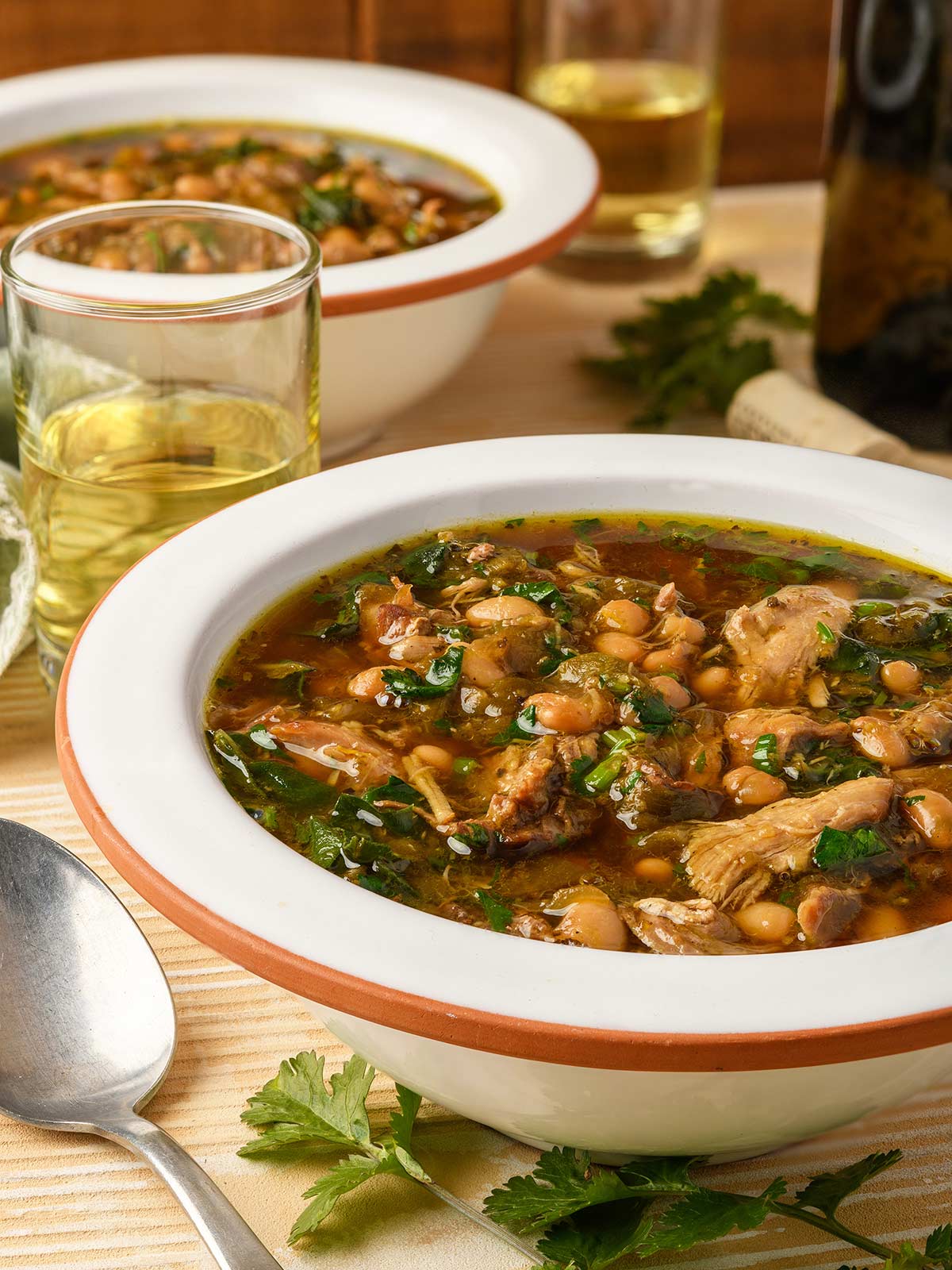 Close up of a bowl of green chile chicken soup. 