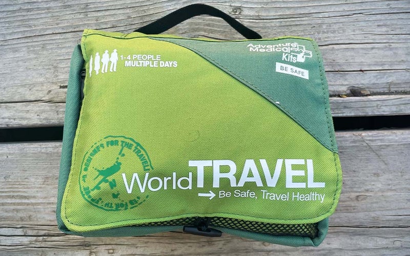 A solid first aid kit with travel-specific supplies like stomach medication.