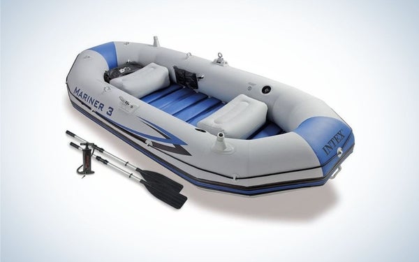 Blue and light gray inflatable boat with black paddles