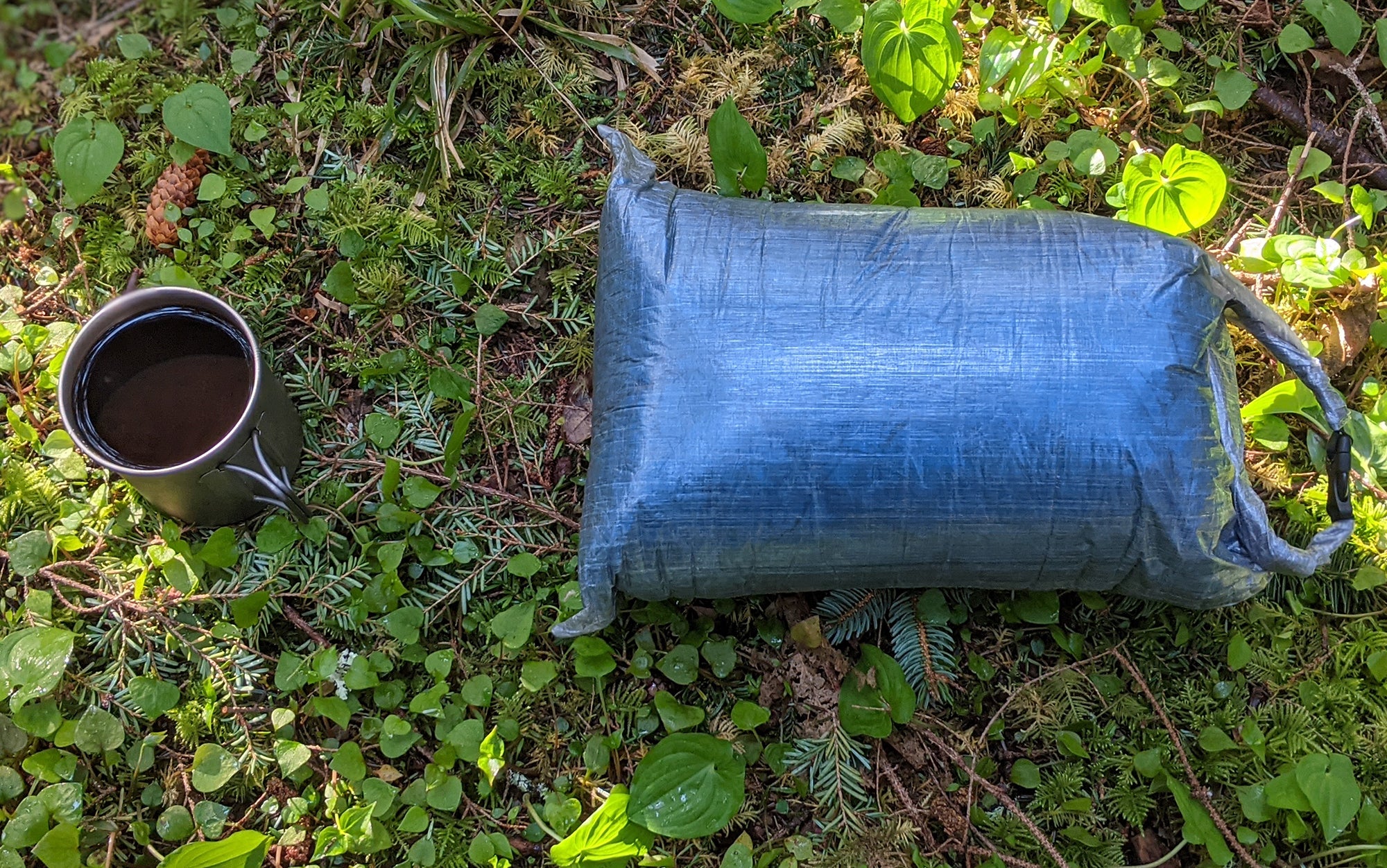 Zpacks stuff sack sits next to coffee cup.