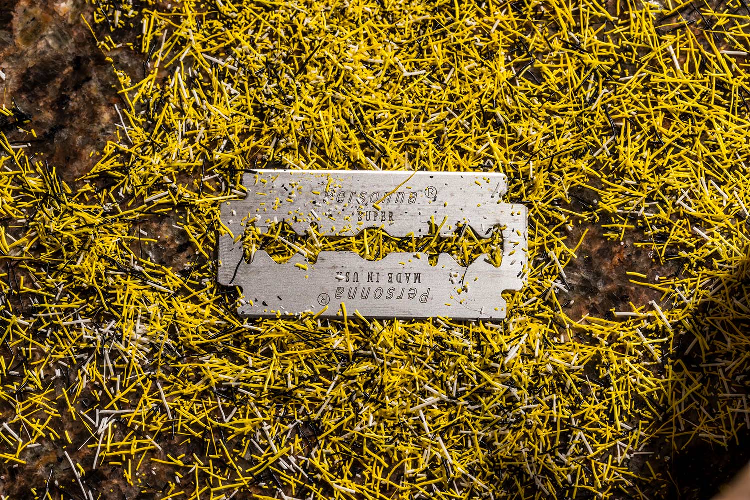 razor blade on top of deer-hair shavings