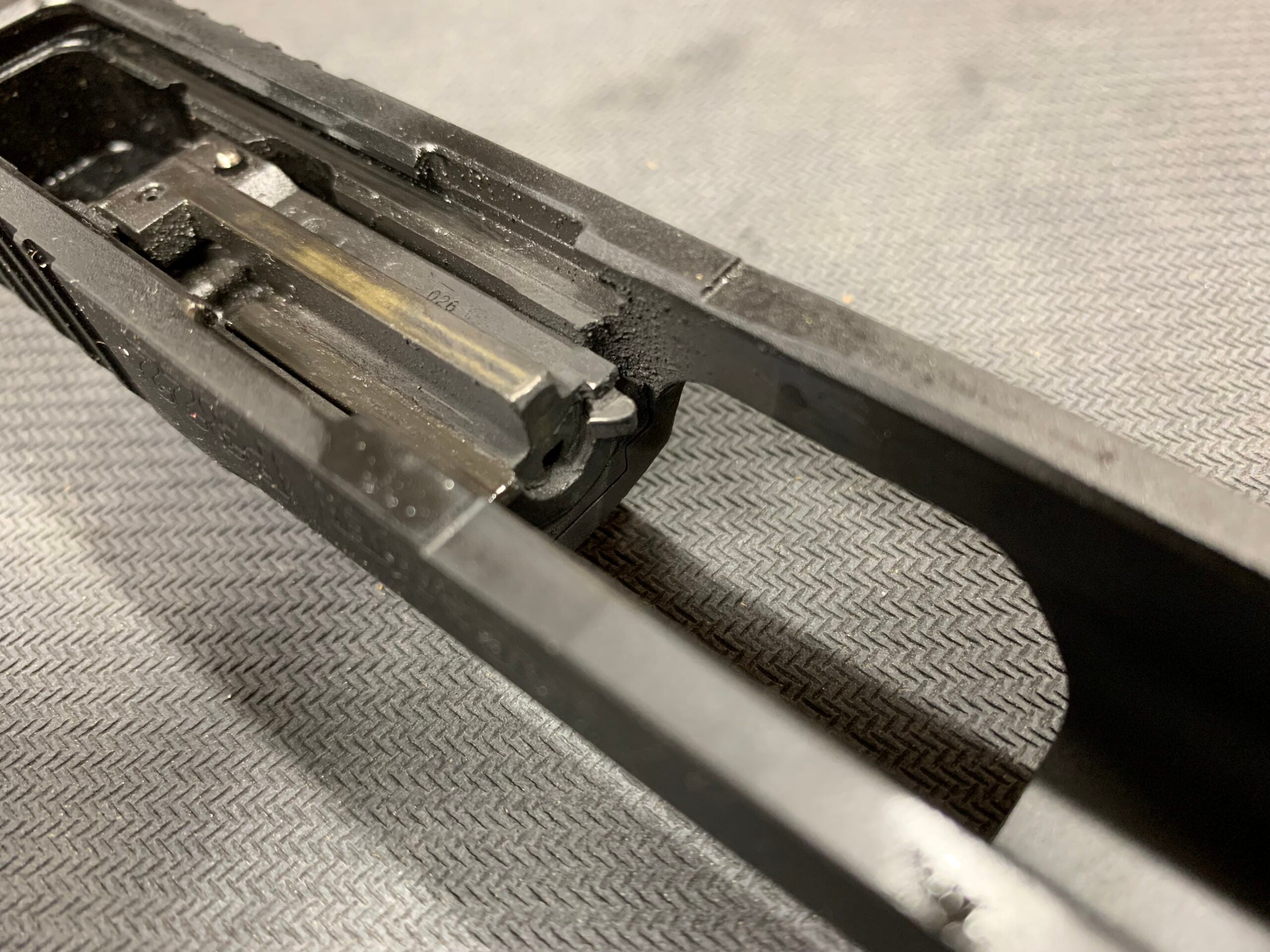The bottom-side of a Sig P322 slide
