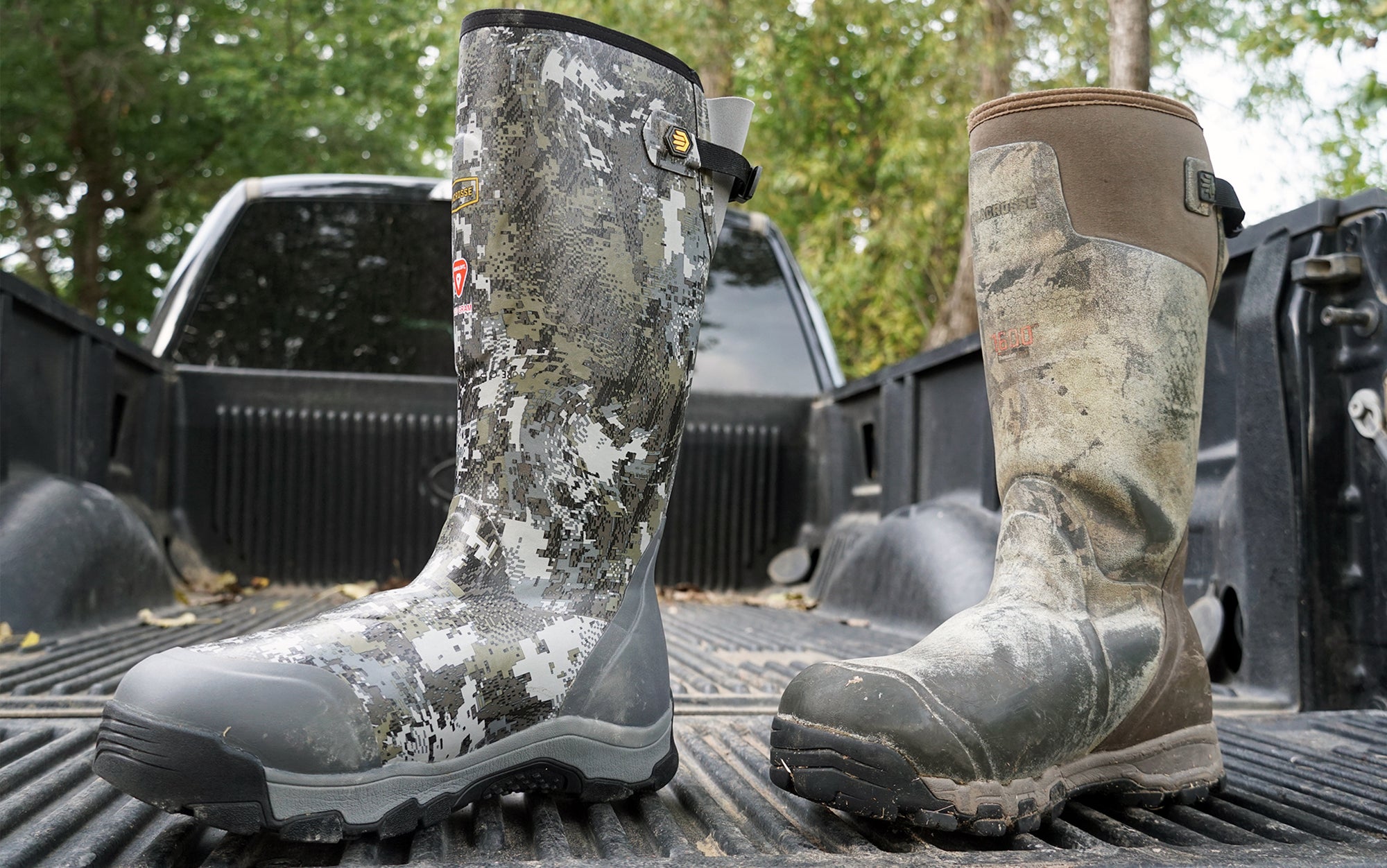 The old and new version of the La Crosse Alphas sit on truck bed.