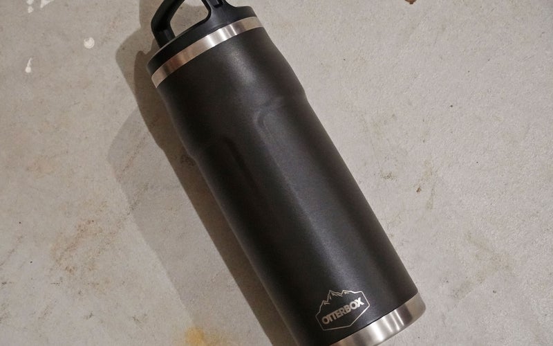 A black Otter Box Elevation Growler thermos