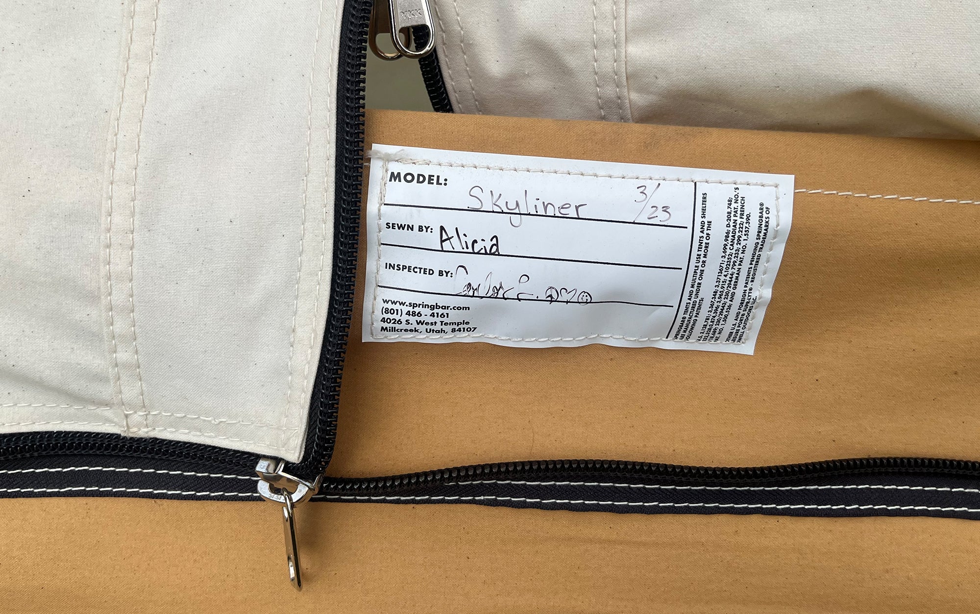 Youâre welcomed into your tent by the person who sewed it with a signed tag at the doorway.