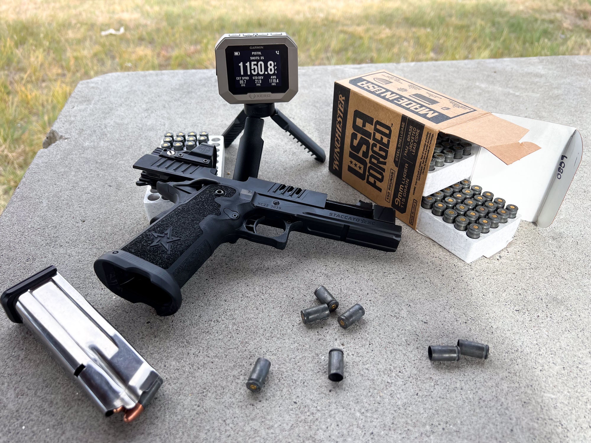 Garmin Xero and Stacatto pistol on bench