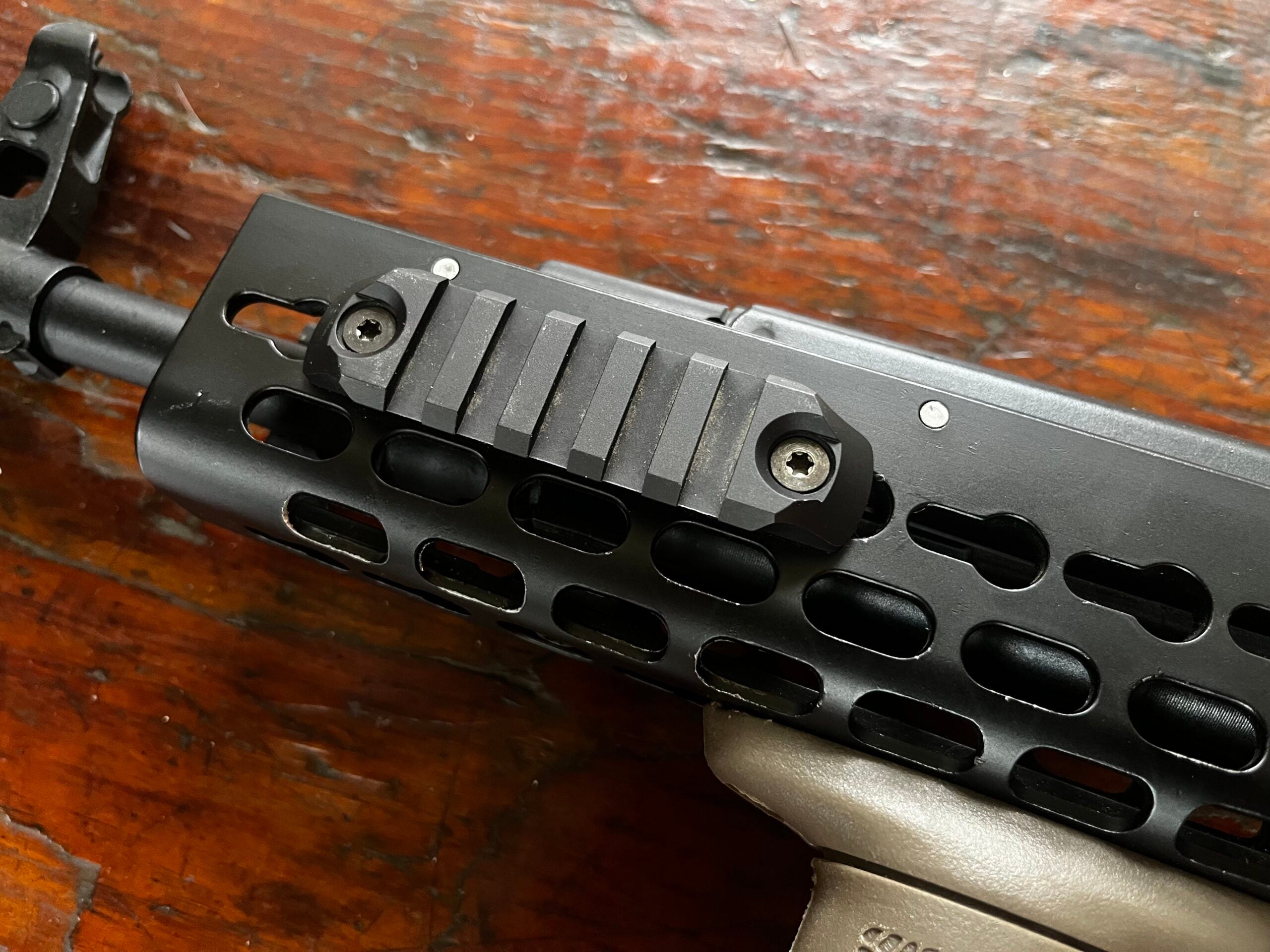 photo of a rifle with a rail attached via the keymod system