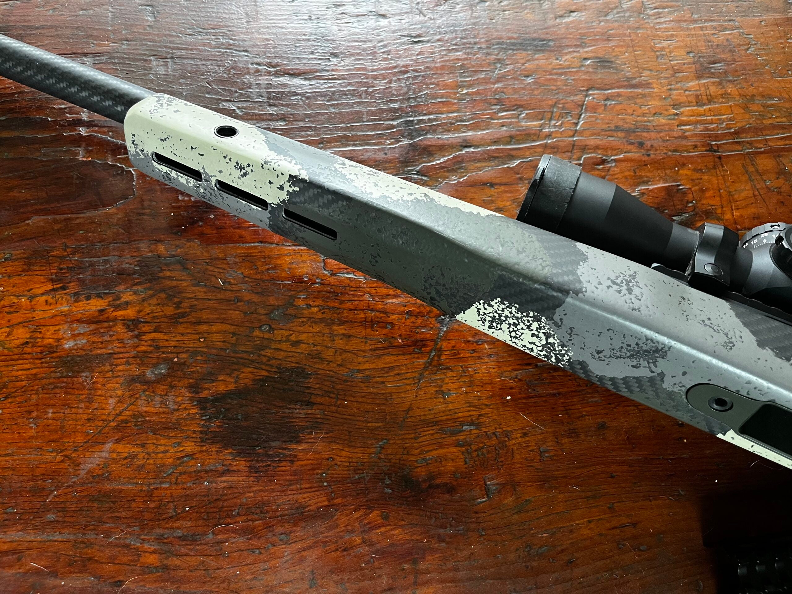 photo of the forend of a hunting rifle with Mlok slots