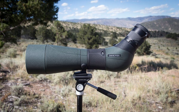 Swarovski ATS 80 spotting scope on tripod with mountains in the background