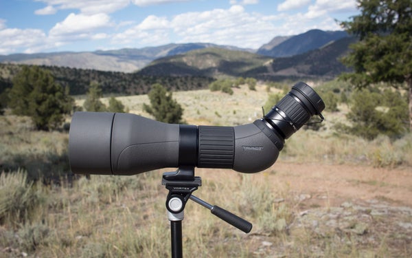 Tract Toric spotter on tripod with mountains in background