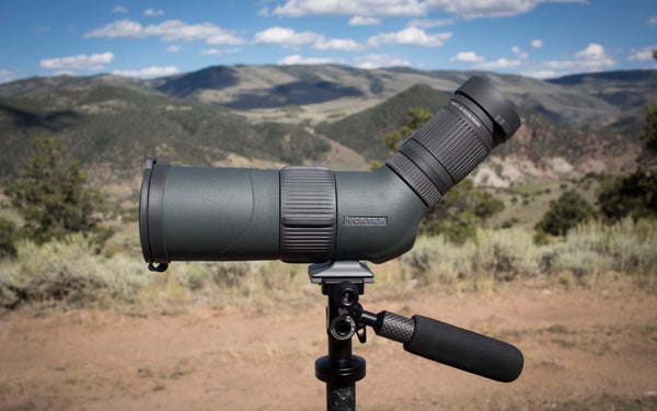 Vortex Razor HD spotting scope on tripod with mountains in the background