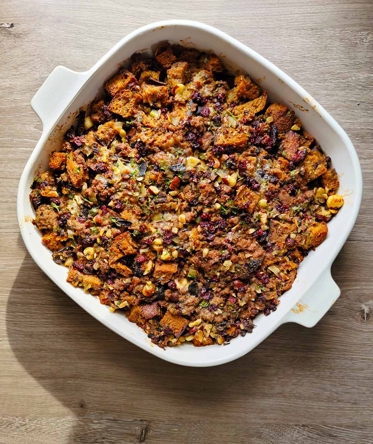 Close up of the casserole dish of cranberry sausage stuffing.