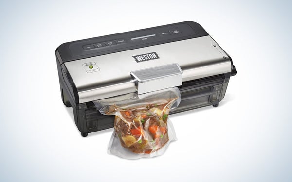 The silver and black Weston wet and dry vacuum sealer on a black and white gradient background.