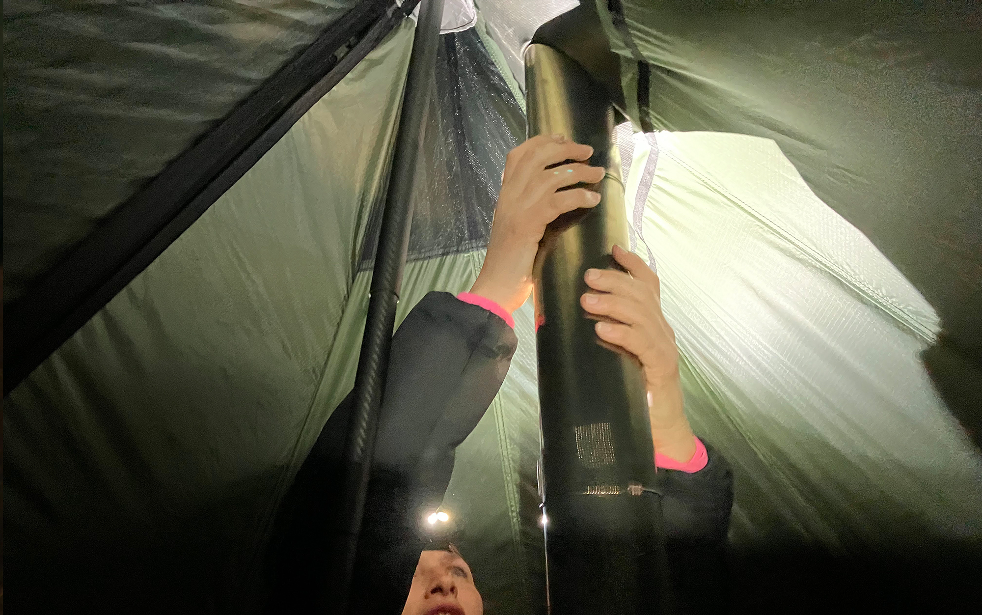 Poking the titanium stove pipe up through the reinforced portion of the Seek Outside Cimarron.