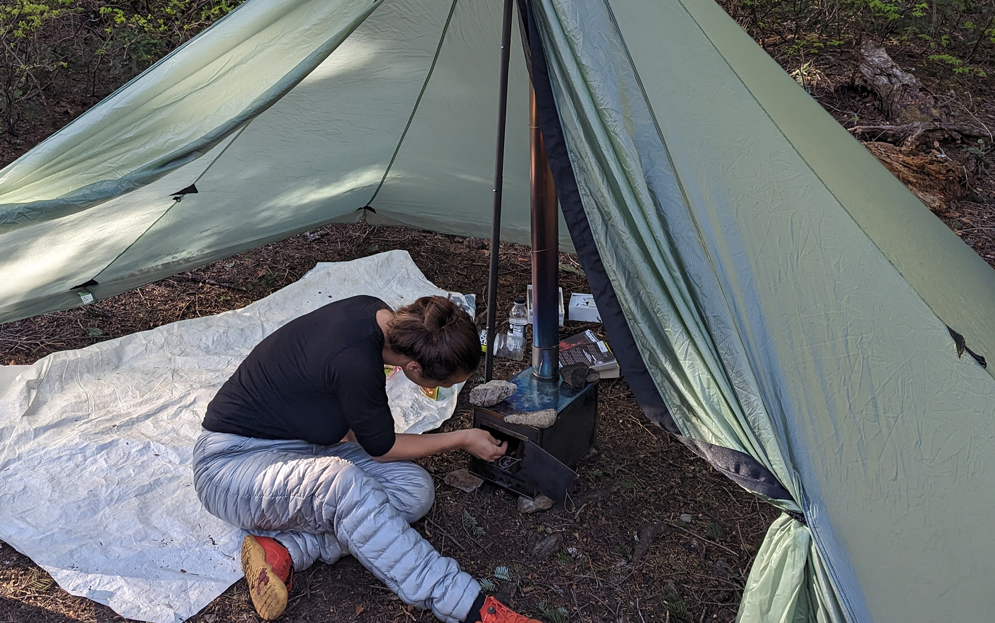 Adding some twigs to the Seek Outside Cimarron on a trip where I had somehow forgotten the stove legs. Fortunately, we were able to Macgyver it together using some rocks instead. 