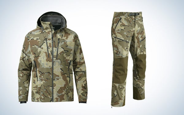Kuiu's Yukon TR heavy-duty rain gear in Valo camo pattern on a black and white gradient background.