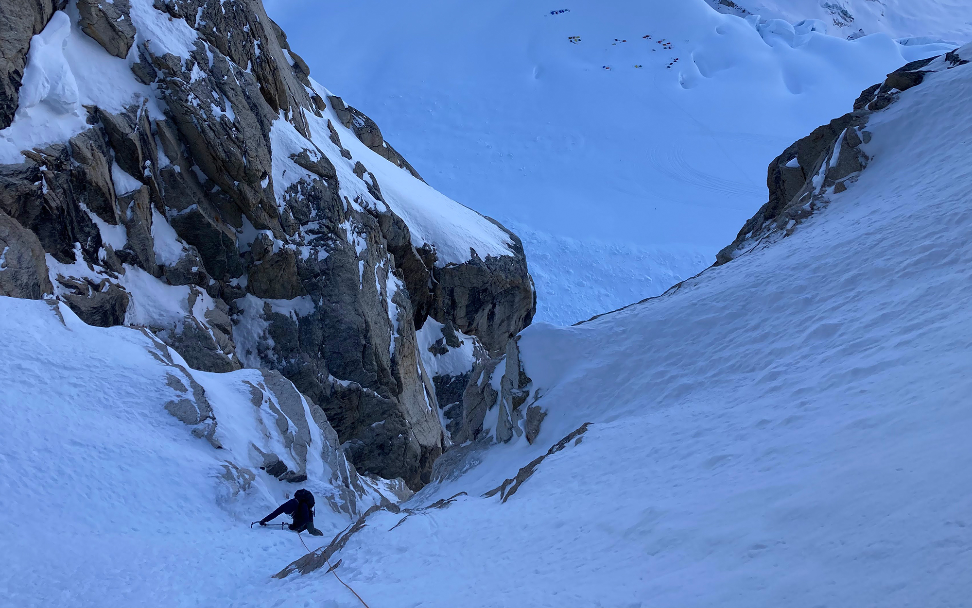 Author climbs up icy mountain side in Petzl Lynx crampons.