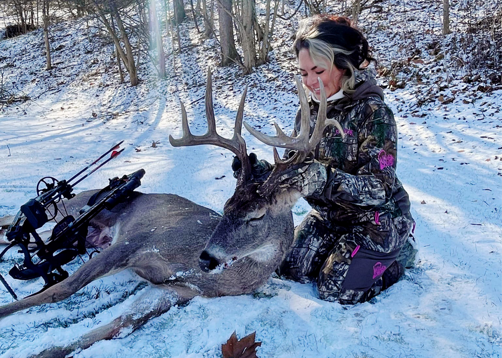 A crossbow hunter poses with an 11-point buck tagged in Ohio.
