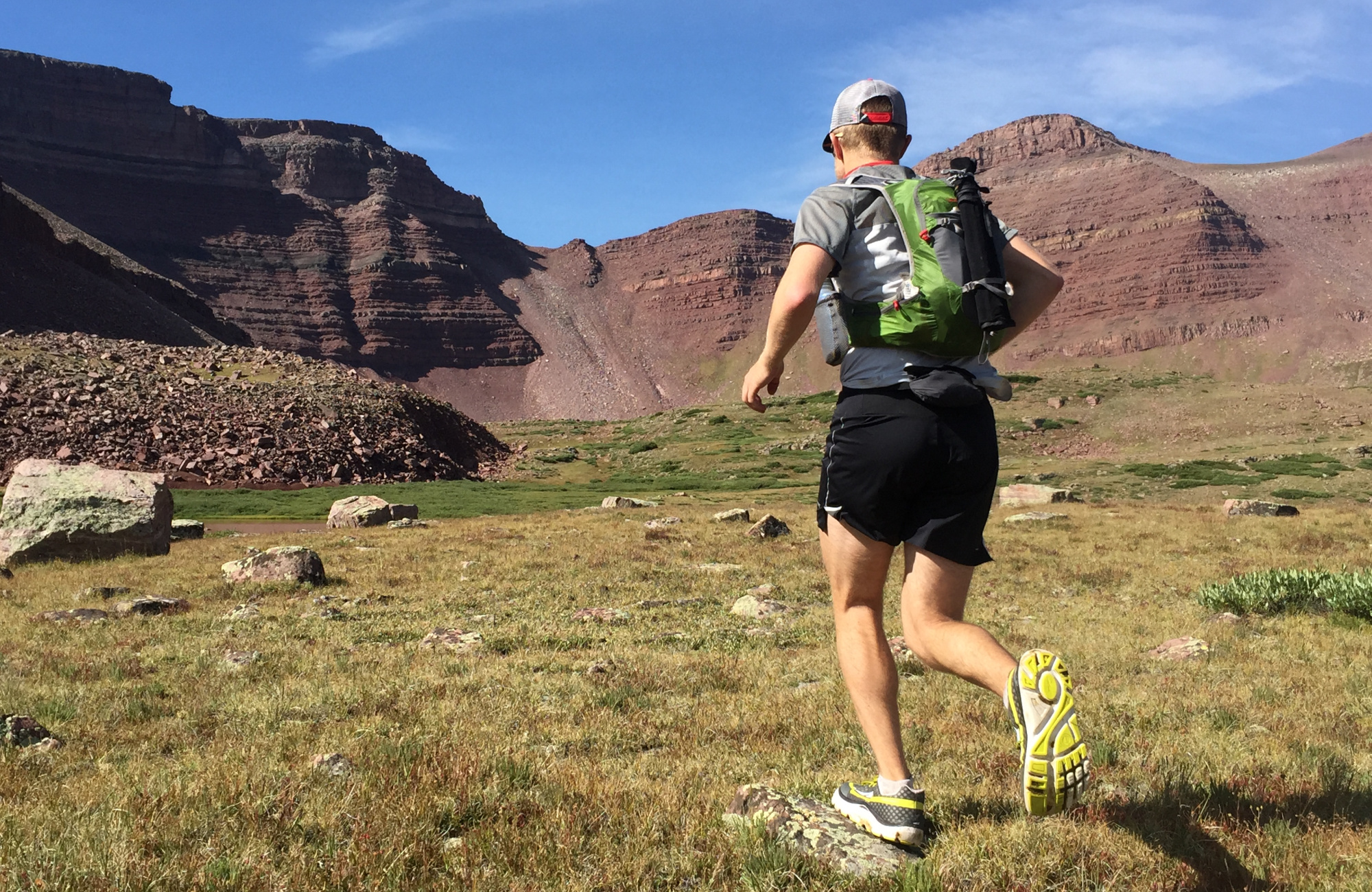 Brian Beckstead runs across an open field.