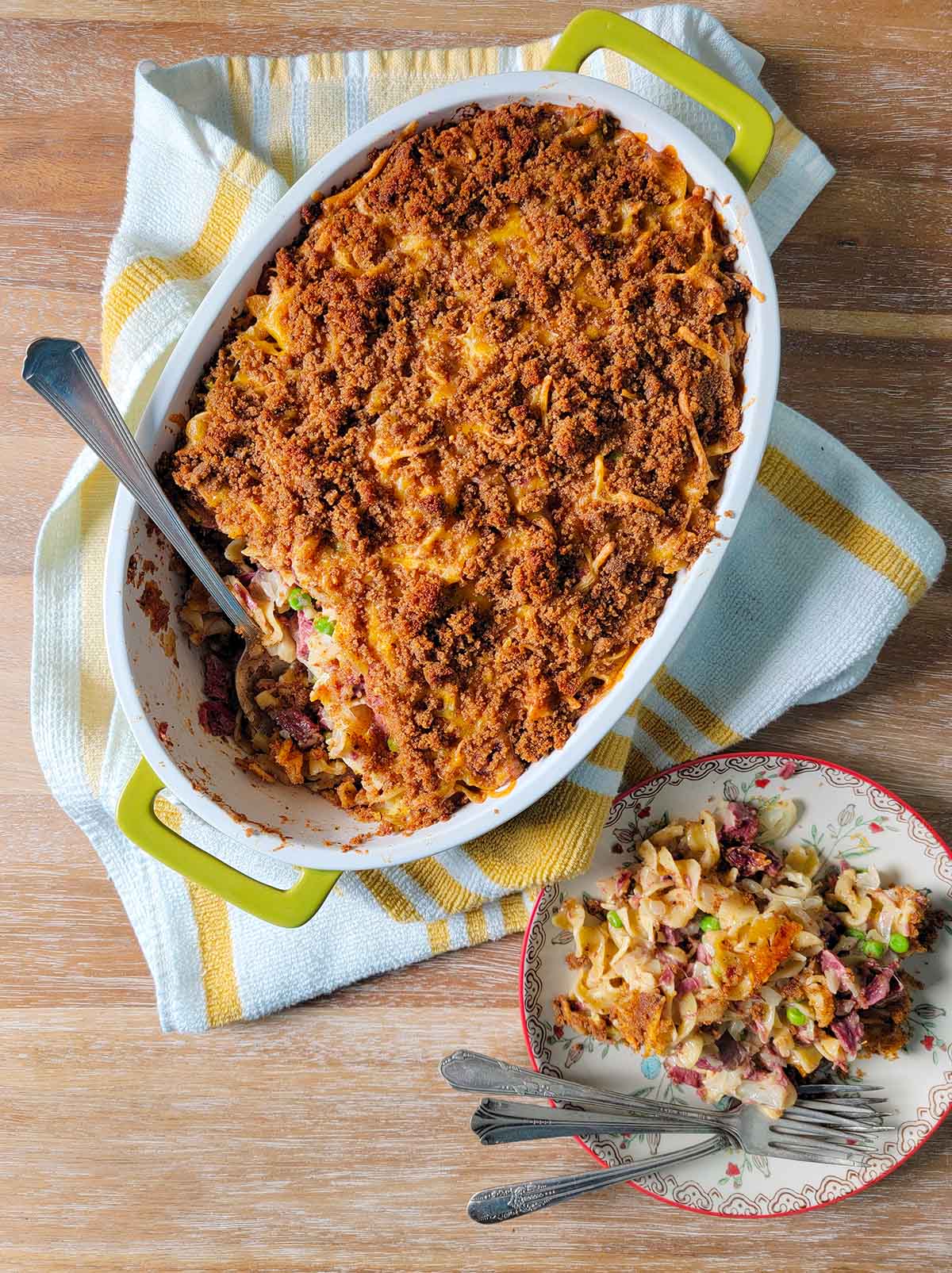 A casserole dish full of corned beef hotdish. 