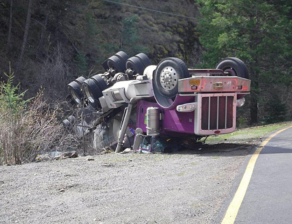 A tanker truck rolled down an embankment.